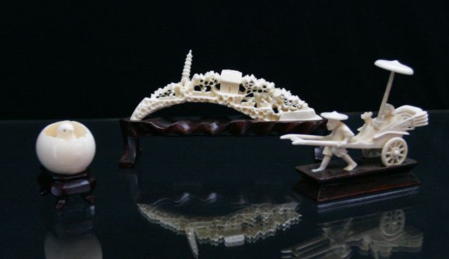 Appraisal: Sixteen ivory bone and resin carvings including an abacus various