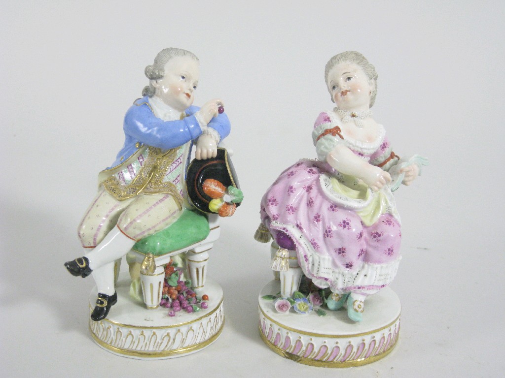 Appraisal: A pair of th Century Meissen Figures seated on circular