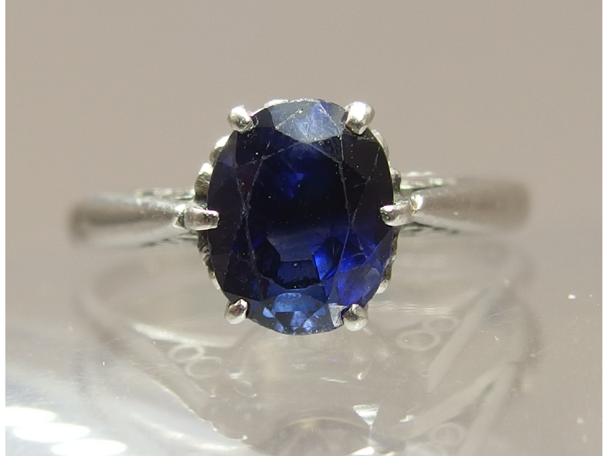 Appraisal: A platinum sapphire ringthe oval mixed cut sapphire is approximately