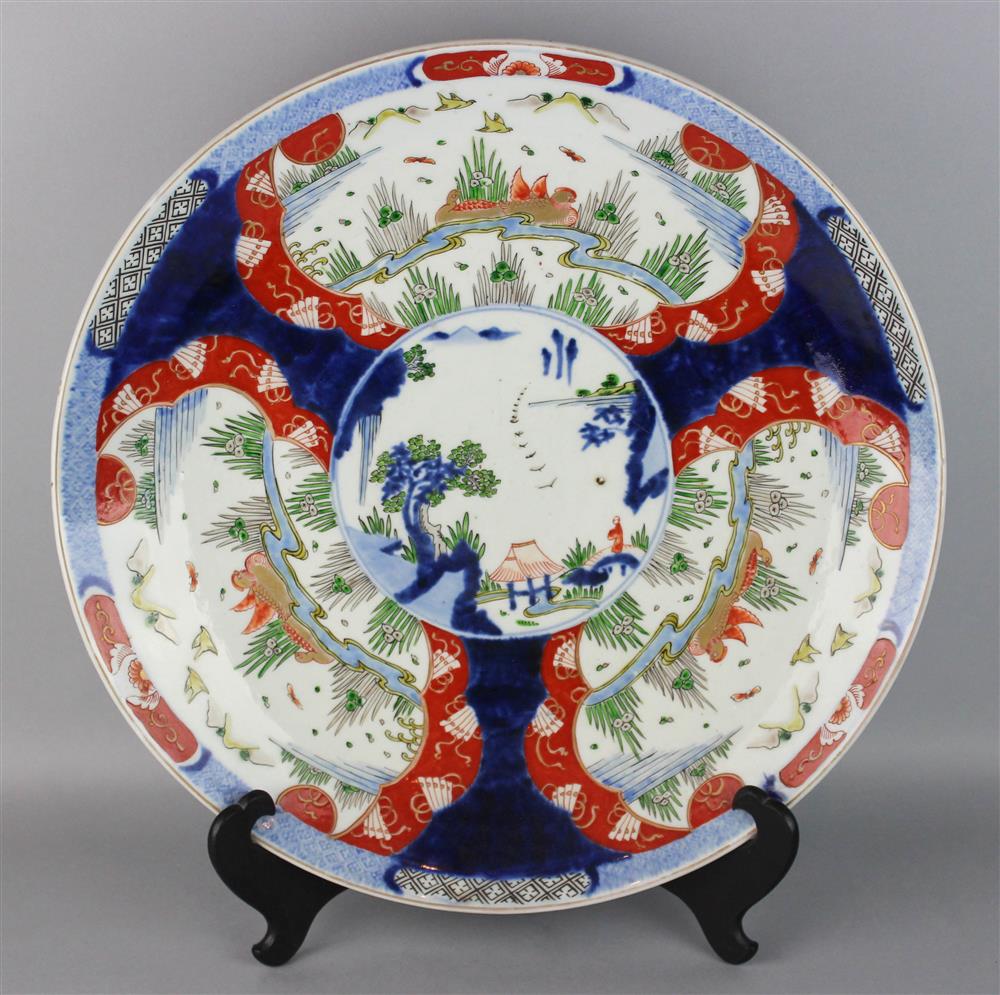 Appraisal: LARGE JAPANESE IMARI CHARGER the central roundel painted with a