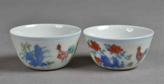 Appraisal: Pair of Small Teacups with Chicken DecorationPair of white porcelain