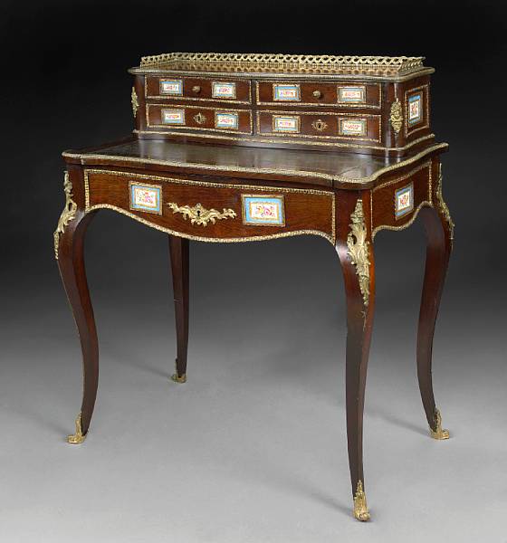 Appraisal: A Louis XV style gilt bronze and porcelain mounted mahogany