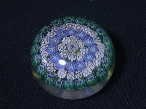 Appraisal: FIVE VARIOUS PAPERWEIGHTS Including a garlanded poinsettia on a white