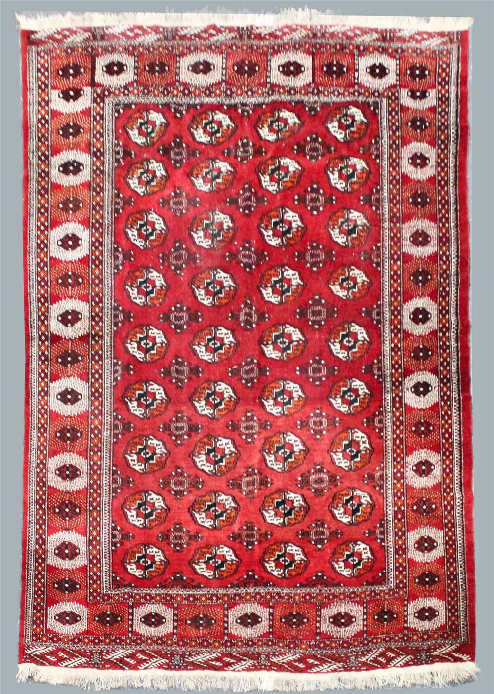 Appraisal: TURKMEN TEKE WOOL RUG having a bokhara design on a