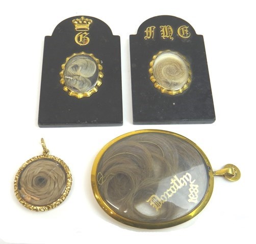 Appraisal: Two Victorian similar gold mounted black onyx miniature memorial headstones