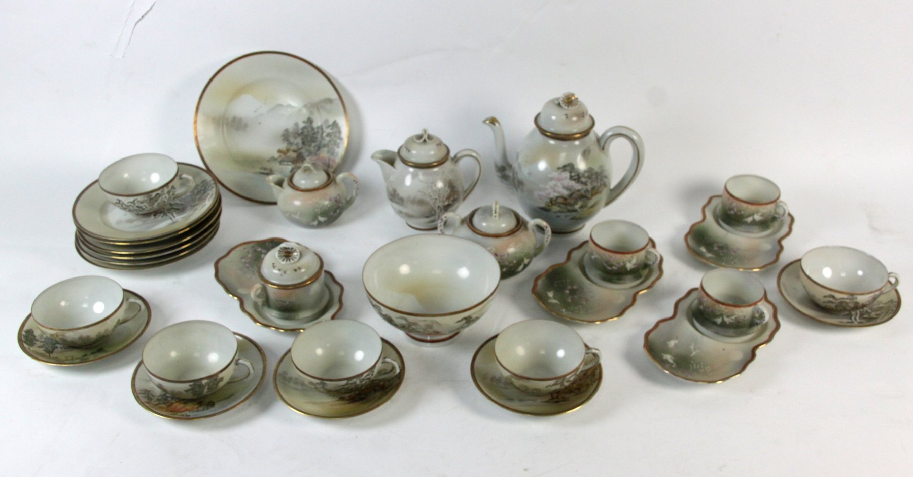 Appraisal: A Japanese eggshell part tea service painted landscapes comprising cups