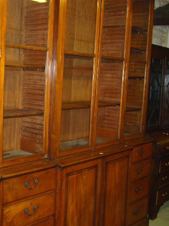 Appraisal: A th century mahogany break front bookcase the upper section