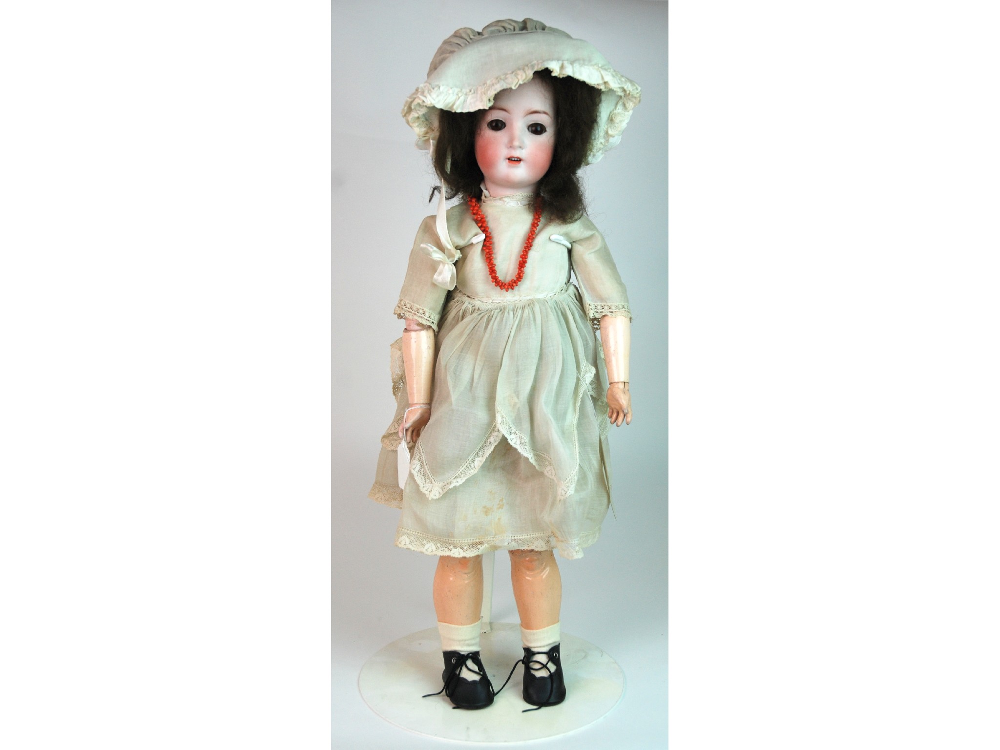 Appraisal: An Alt Beck Gottschalck bisque-headed dollwith open and close brown