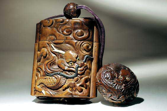 Appraisal: ANTIQUE WOOD INRO SET Finely carved antique single-case wood inro