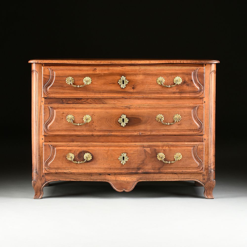 Appraisal: A FRENCH PROVINCIAL CARVED WALNUT COMMODE TH CENTURY A FRENCH