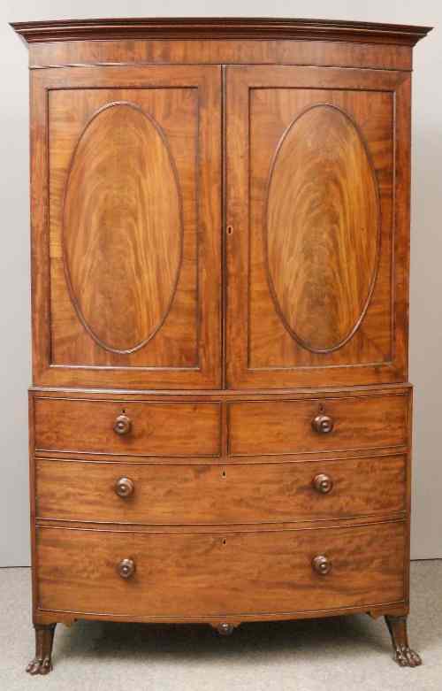 Appraisal: A George IV gentleman's mahogany bow-front wardrobe in the ''Irish''