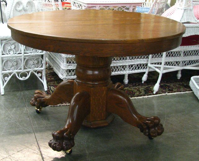 Appraisal: Round oak paw-foot dining table with one leaf circa early