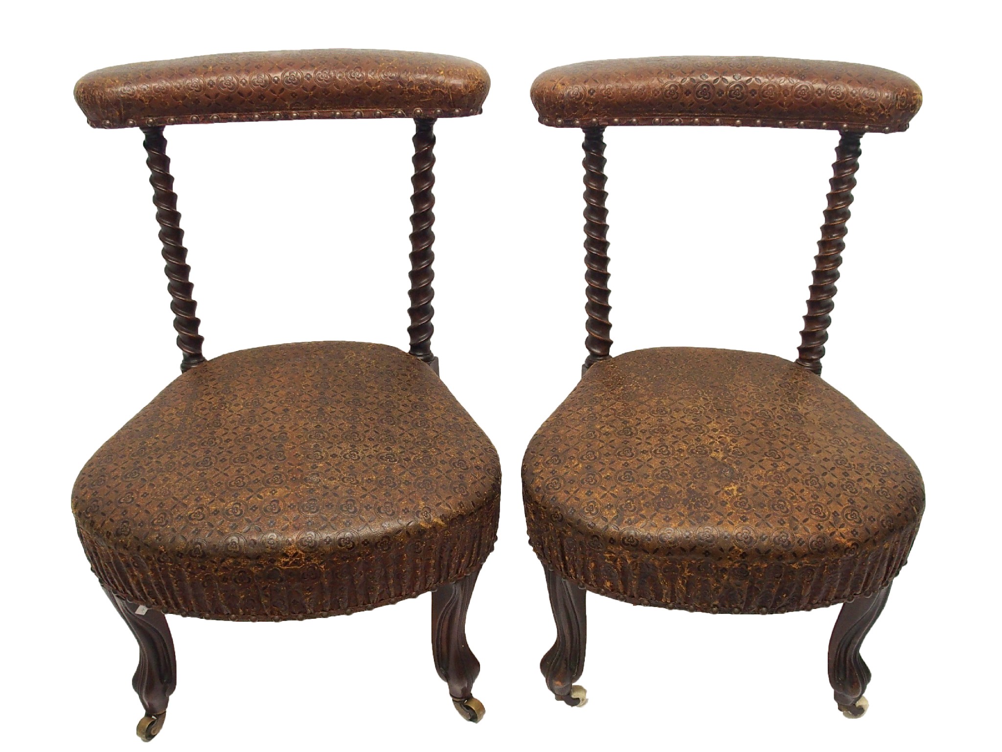 Appraisal: A pair of Victorian rosewood prie dieu chairswith spiral spars