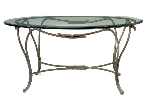 Appraisal: A contemporary glass and cast iron table height in width