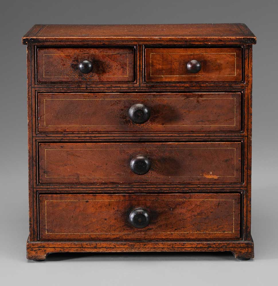 Appraisal: Five-Drawer Miniature Chest American early th century ash with curly