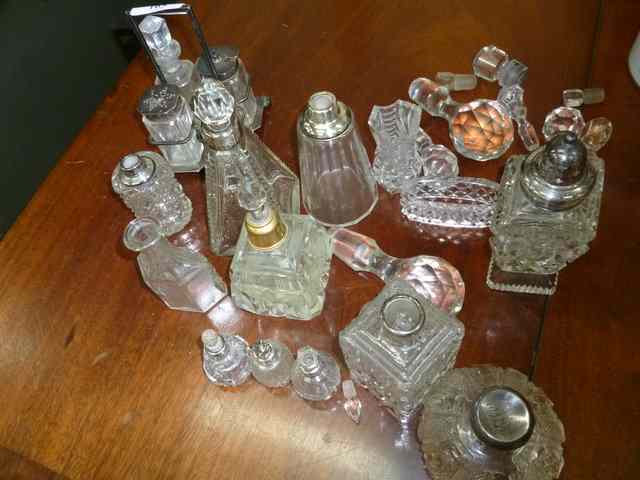 Appraisal: A GLASS AND SILVER TOPPED PART CRUET SET all on