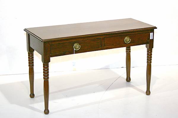 Appraisal: A Federal style mahogany two drawer occassional table height in