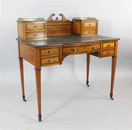 Appraisal: An Edwardian Maple Co marquetry inlaid satinwood desk ft in