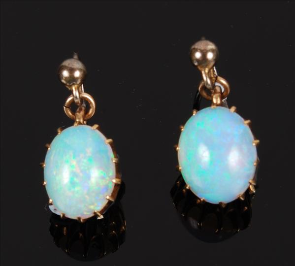 Appraisal: A pair of opal earrings each suspending an oval cabochon