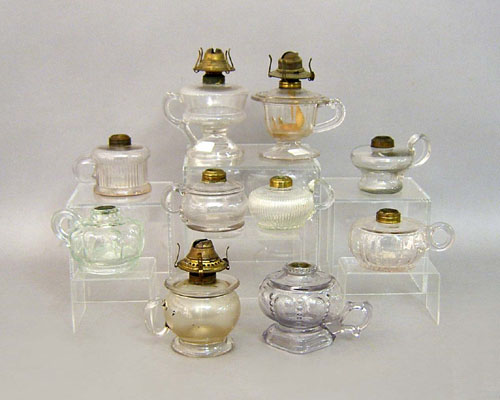 Appraisal: Ten colorless glass fluid lamps