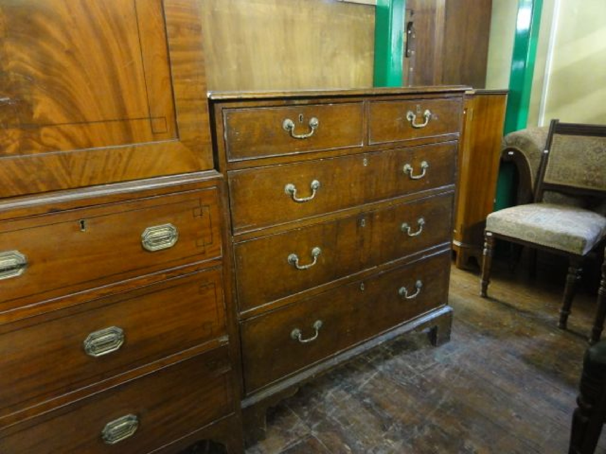 Appraisal: A Georgian oak country made chest of three long and