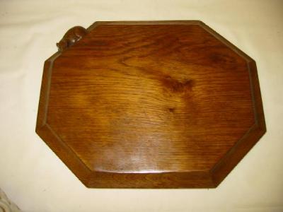 Appraisal: AN ADZED OAK BREAD BOARD by Robert Mouseman Thompson of