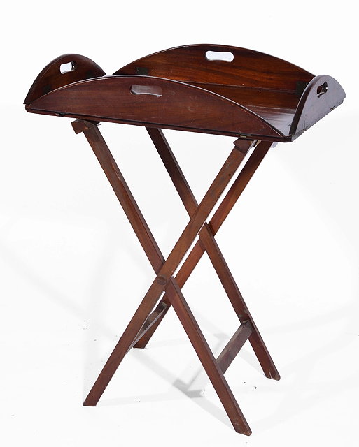 Appraisal: th Century mahogany butler's trayon stand with oval folding top