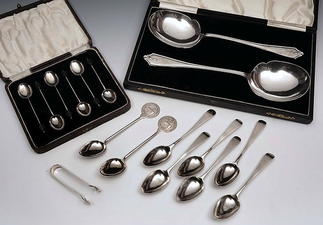 Appraisal: A PAIR OF SILVER SERVING SPOONS Birmingham in fitted case