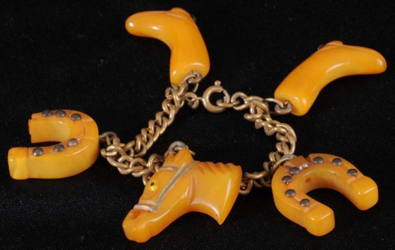 Appraisal: Bakelite Western Charm Bracelet Description charms are about long each