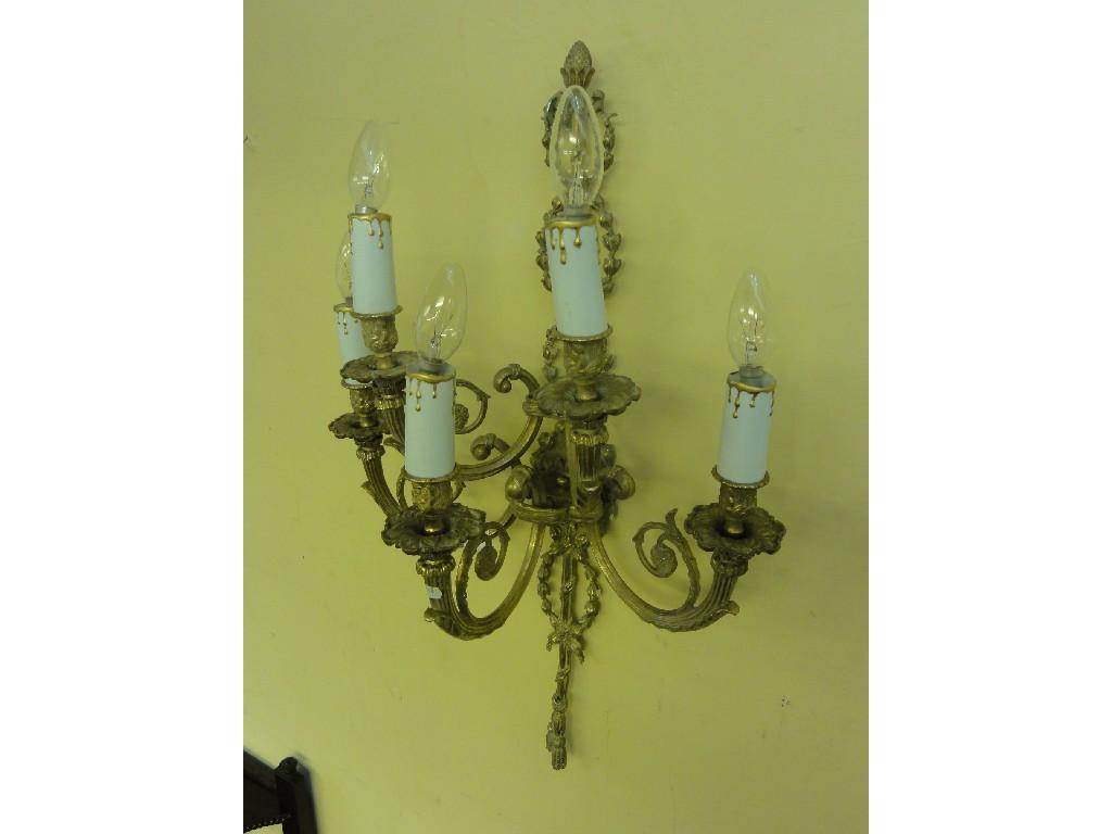 Appraisal: A cast gilt wall sconce adorning five scrolling acanthus branches