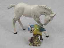 Appraisal: Beswick a blue tit numbered approx cm and a horse