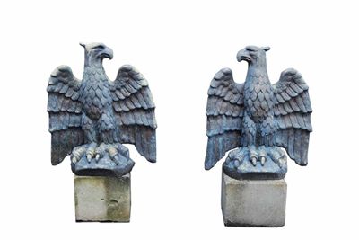 Appraisal: A pair of painted reconstituted stone models of spread eagles