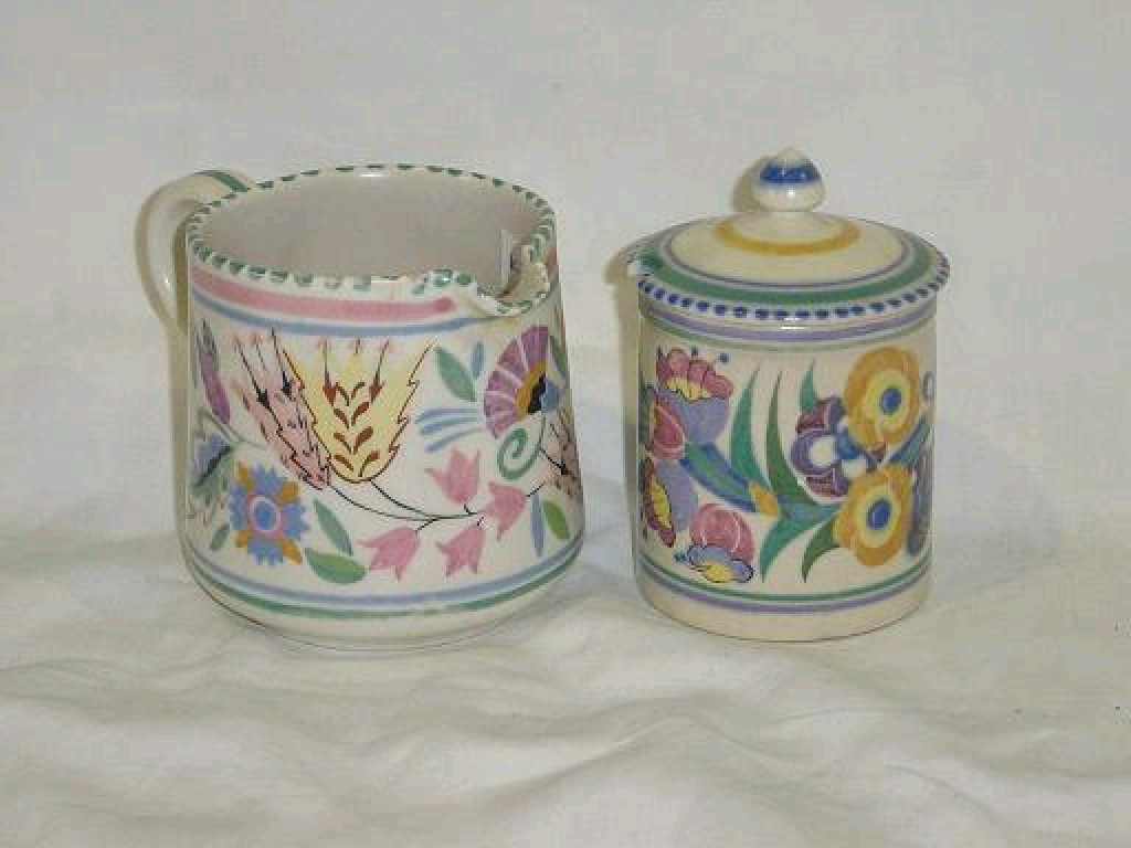 Appraisal: A Poole Pottery jam pot and cover with painted floral