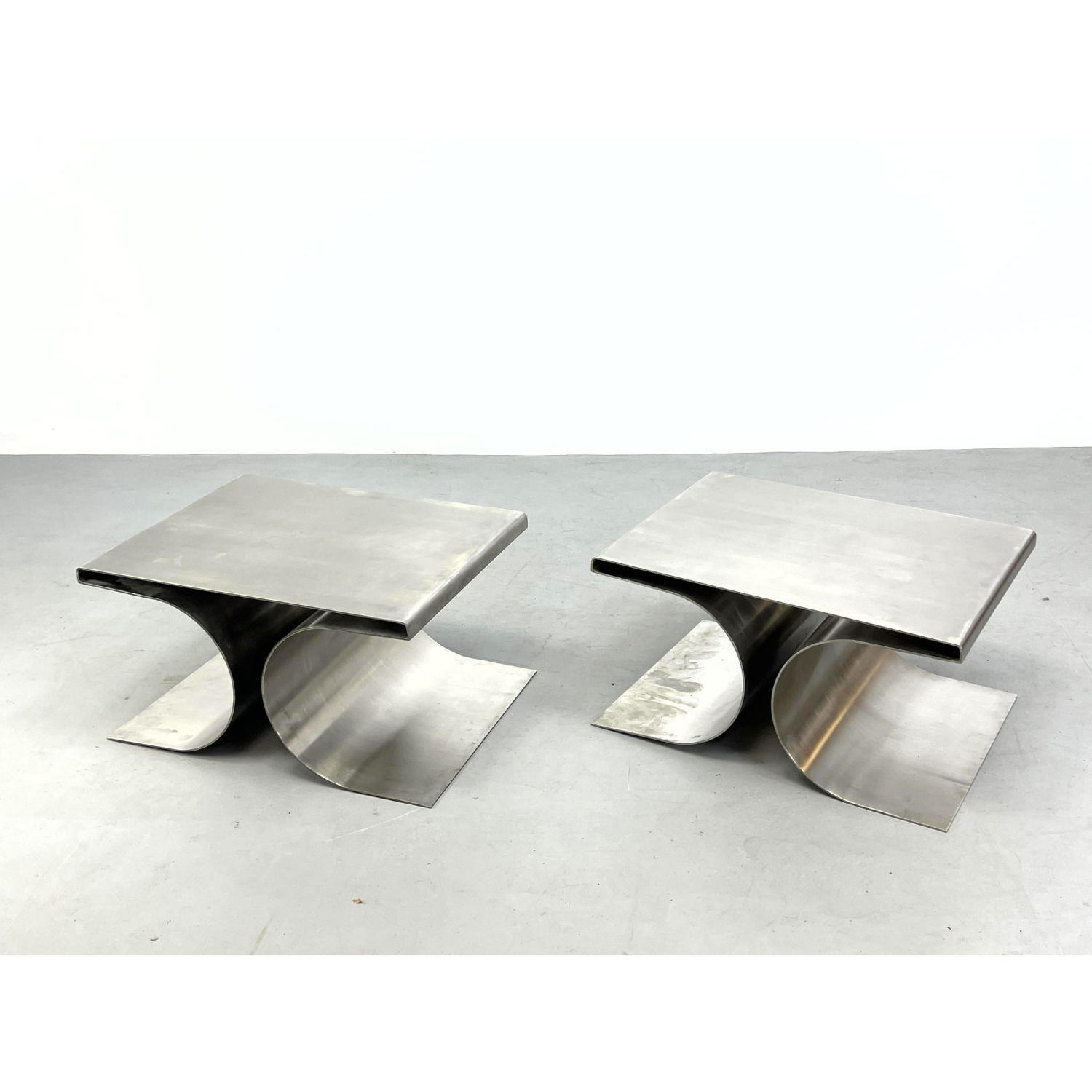 Appraisal: Pr Modernist Stainless Steel Side Table Stools Corseted form Contemporary