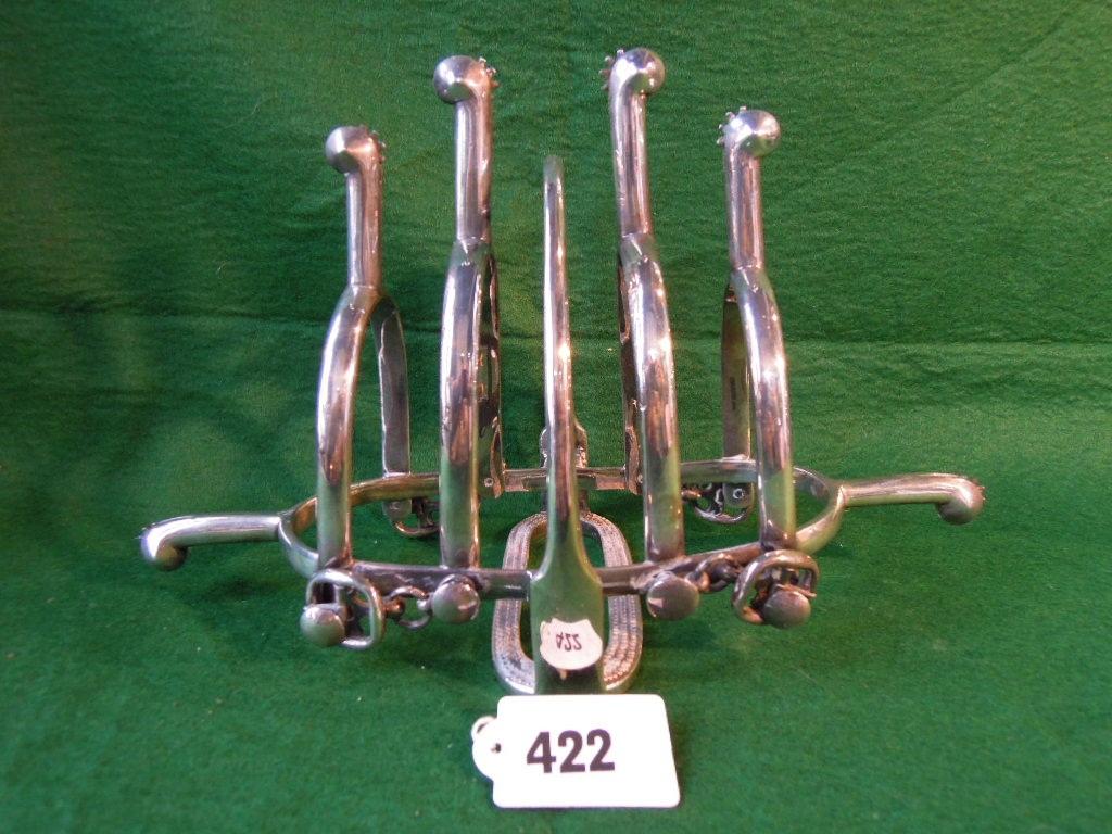 Appraisal: A silver plated toast rack formed from a central stirrup