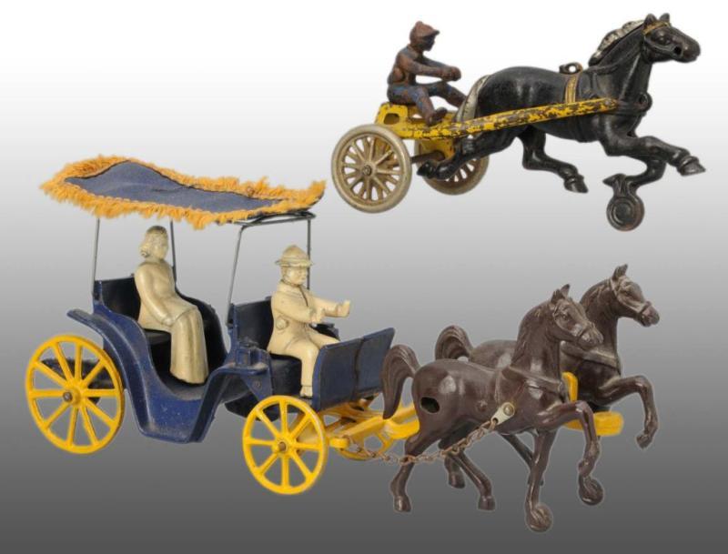 Appraisal: Lot of Cast Iron Horse-Drawn Toys Description American Includes one