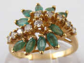 Appraisal: A yellow metal tests carat gold emerald and diamond ring