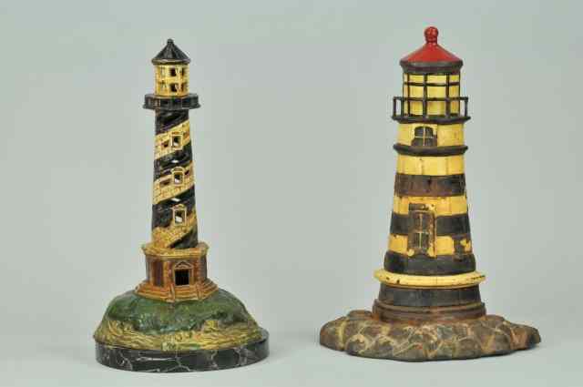 Appraisal: LOT OF TWO LARGE LIGHTHOUSE DOORSTOPS Cast iron black white