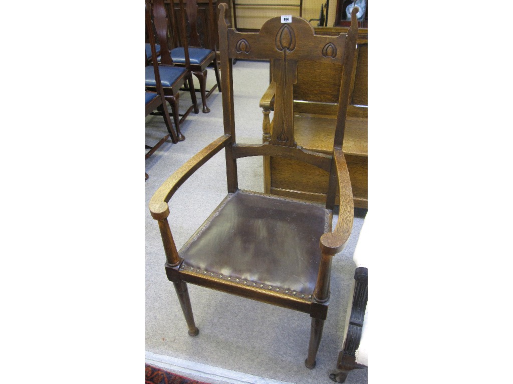 Appraisal: Art Nouveau oak open armchair the central splat decorated with