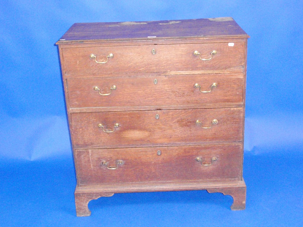 Appraisal: A George III oak chest of four graduated draws with