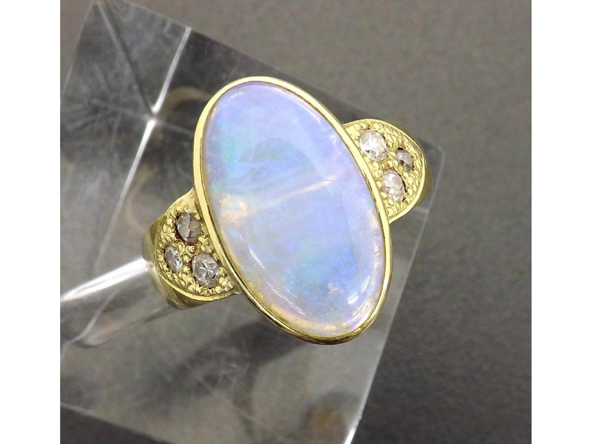 Appraisal: Large water opal and diamond dress ring in yellow gold