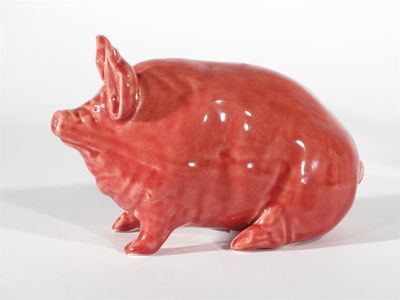 Appraisal: A Wemyss pottery pig covered in a pink glaze impressed