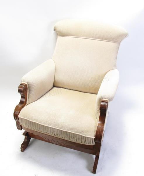 Appraisal: A vintage upholstered platform rocking chair with carved base cream