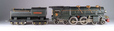 Appraisal: LIONEL E LOCOMOTIVE In gunmetal gray with -wheel oil tender