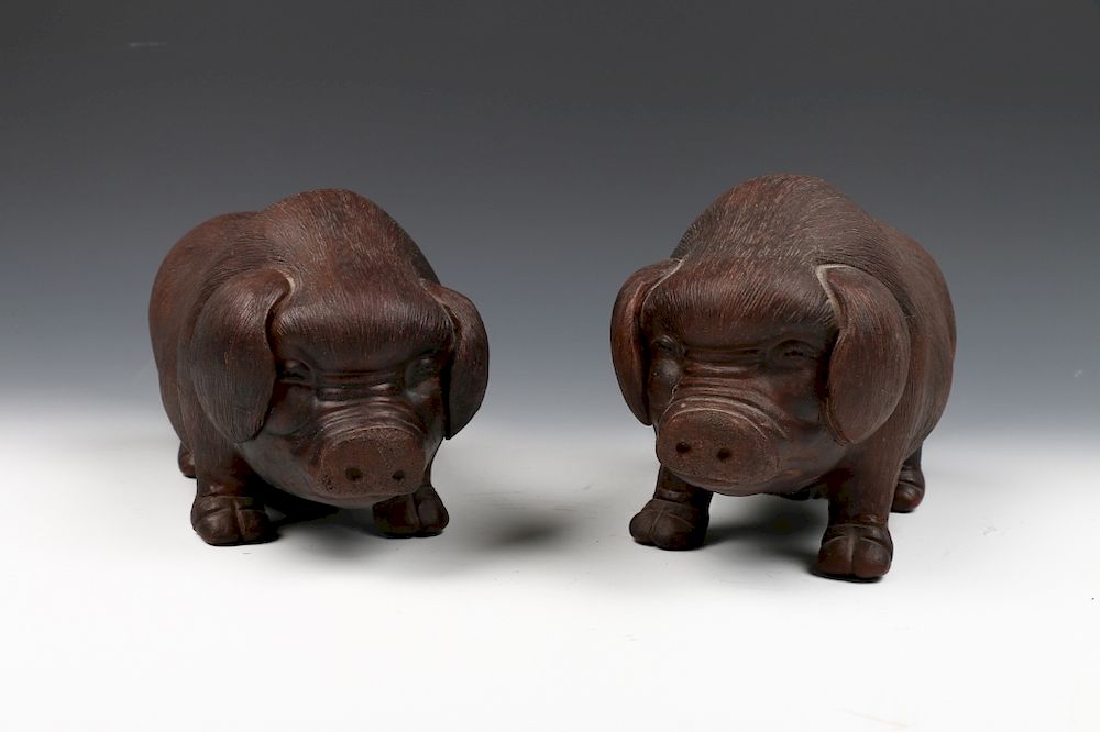 Appraisal: PAIR OF CHINESE ZISHA PIGS The group comprises of two