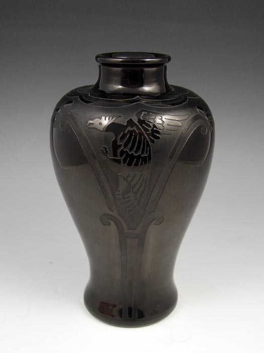 Appraisal: STEUBEN BLACK ACID CUT VASE Black on black dragon design