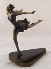 Appraisal: A bronzed Art Deco style figure of a young girl