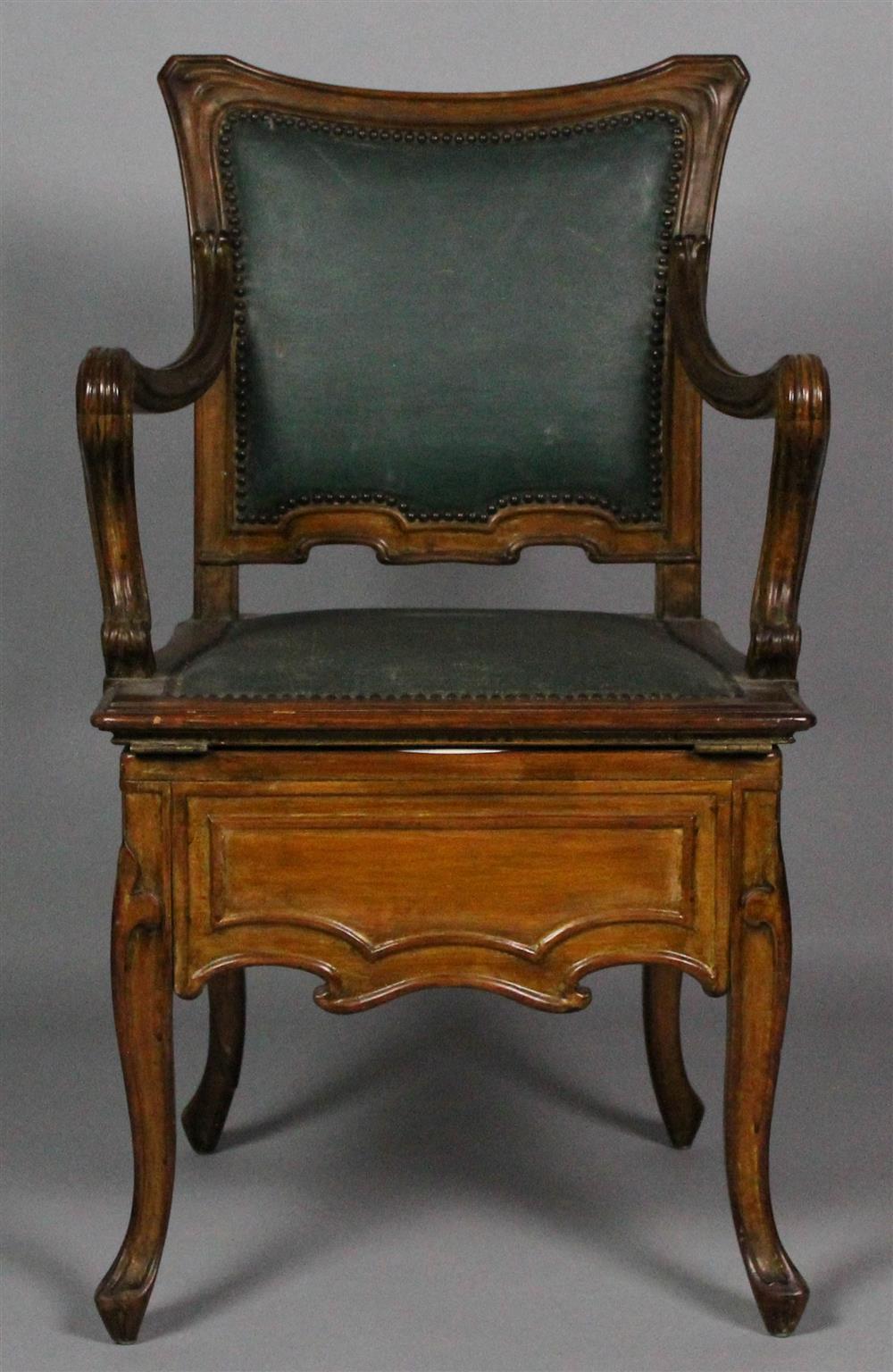 Appraisal: FRENCH CARVED AND MOLDED WALNUT BIDET CHAIR having a shaped