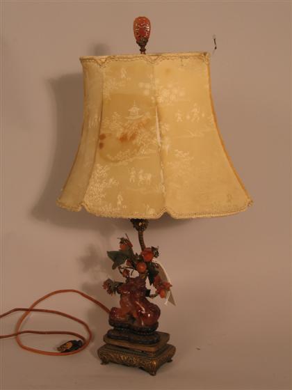 Appraisal: Gilt metal table lamp with small carved carnelian phoo dog