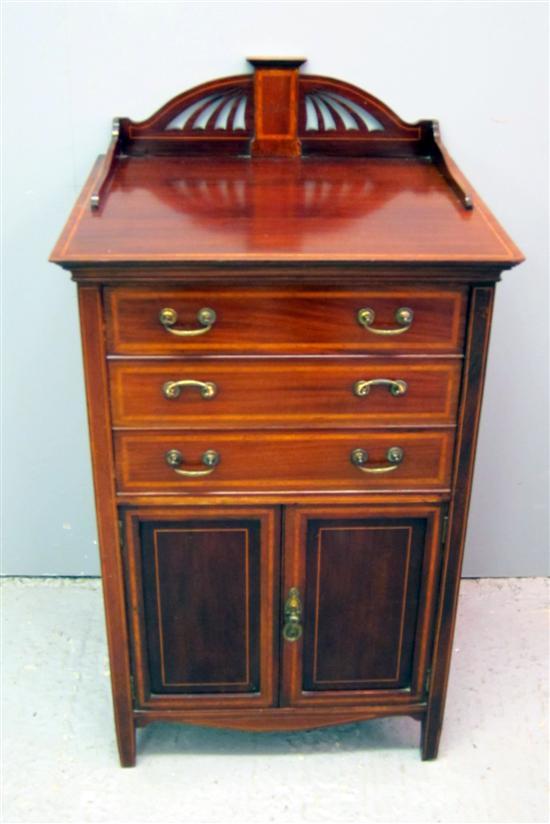 Appraisal: Early th century mahogany ebony and boxwood strung music cabinet